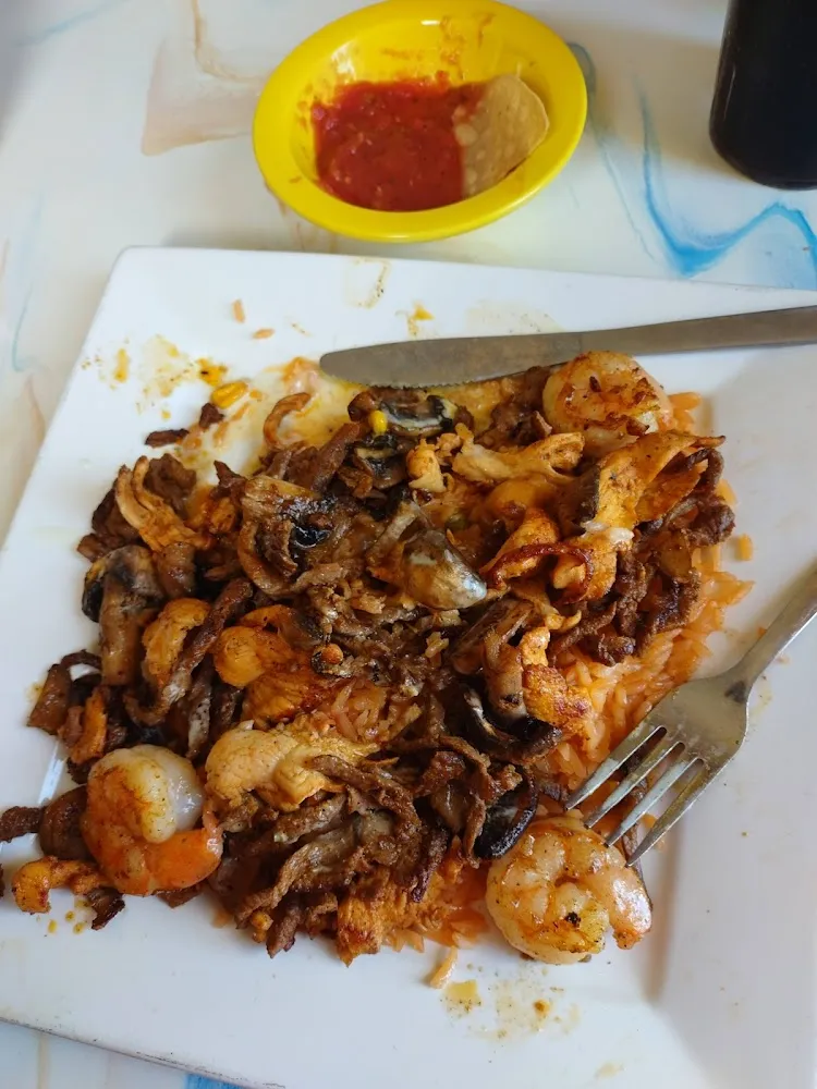 Shrimp Chicken and Beef over Rice with Queso